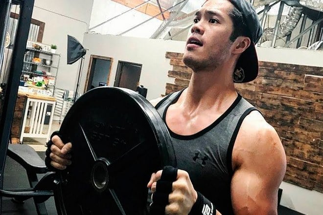 Ross Butler in a gym
