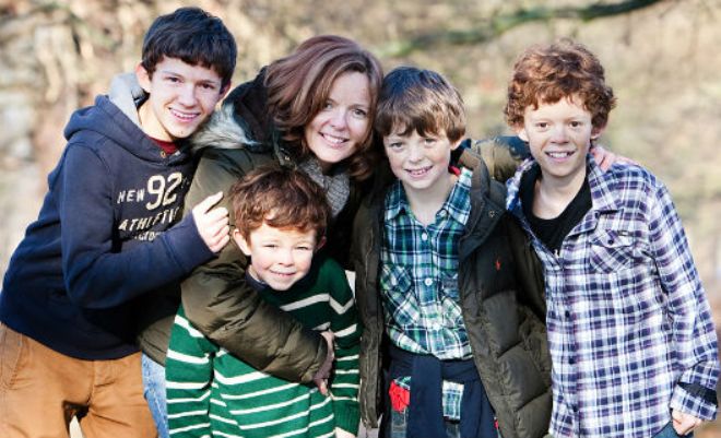Little Tom Holland with his mother and brothers
