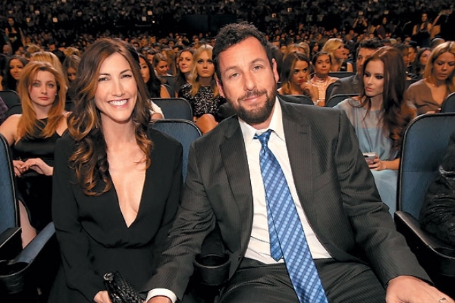Adam Sandler with his wife