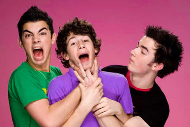 Nick Jonas with his brothers in the Jonas Brothers band