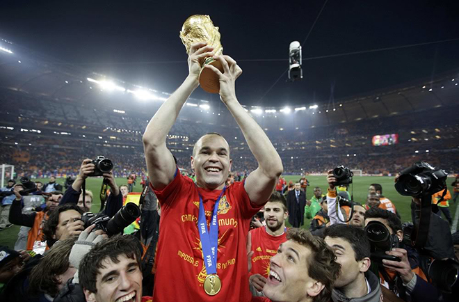 Andrés Iniesta with a cup