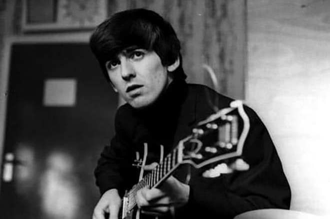 George Harrison with a guitar