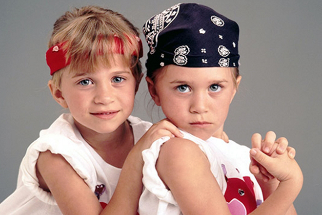 Ashley Olsen and Mary-Kate Olsen in childhood