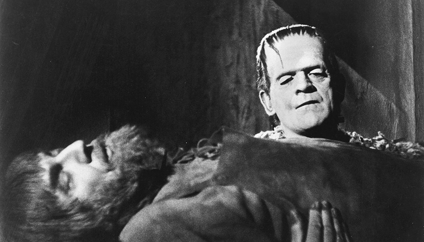 Boris Karloff playing Frankenstein