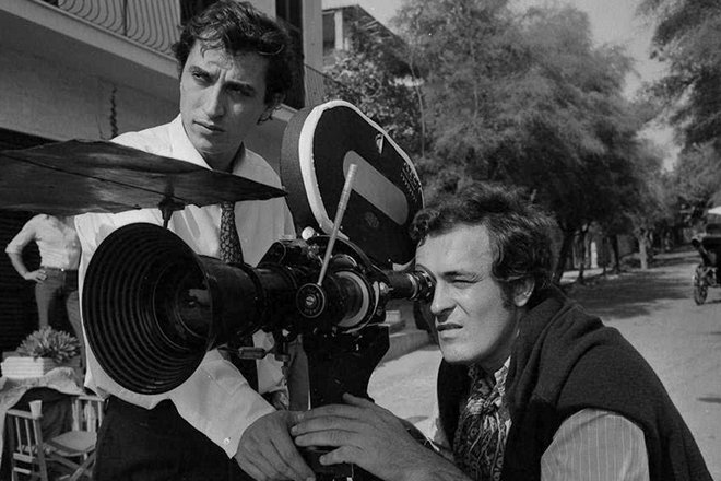 Bernardo Bertolucci on the set