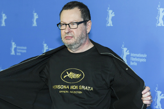 Lars Von Trier in a T-shirt that says "Persona non grata."
