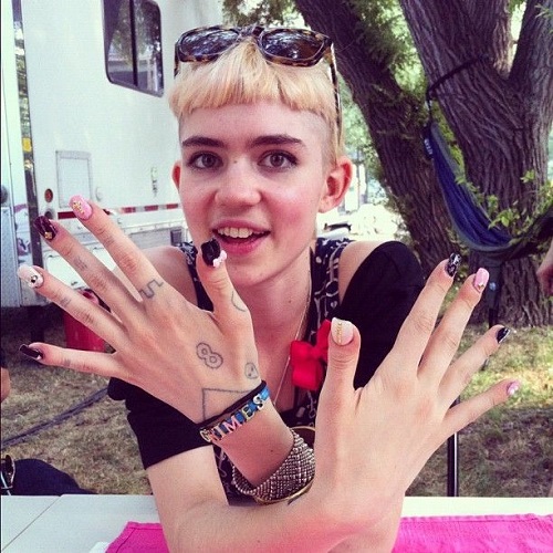 Grimes and her tattoos