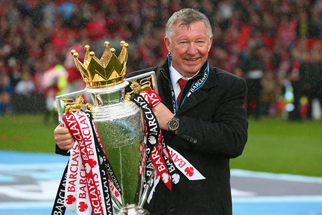 The coach for Manchester United Football Club, Alex Ferguson with the English Football League Cup
