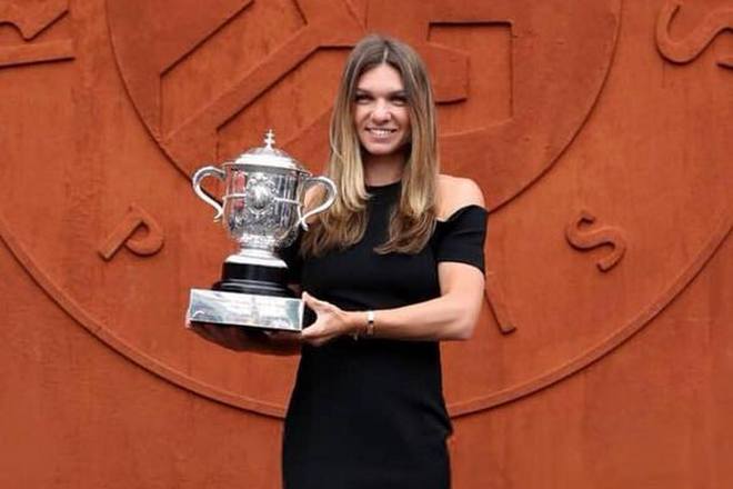 Simona Halep with her tennis trophy