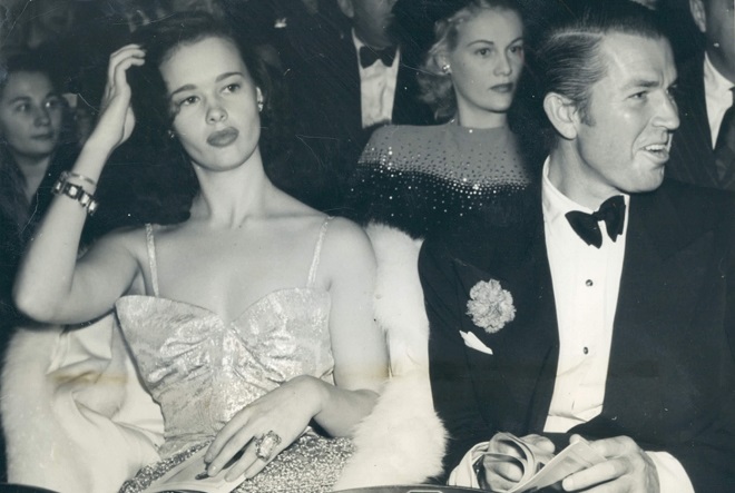 Bruce Cabot and Gloria Vanderbilt attend a theater in Hollywood November 29, 1941