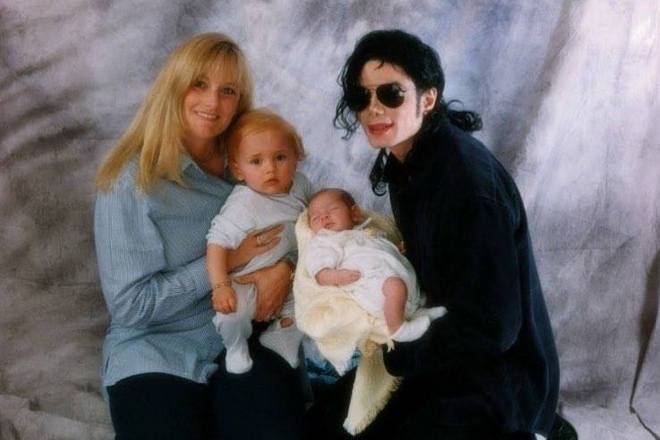 Debbie Rowe and Michael Jackson with their children