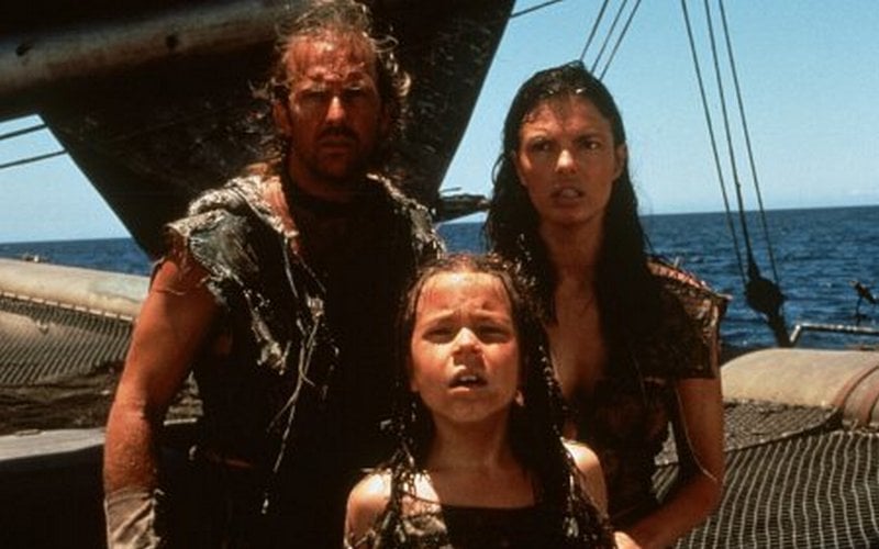 Kevin Costner, Tina Majorino and Jeanne Tripplehorn (a shot from the movie Waterworld)