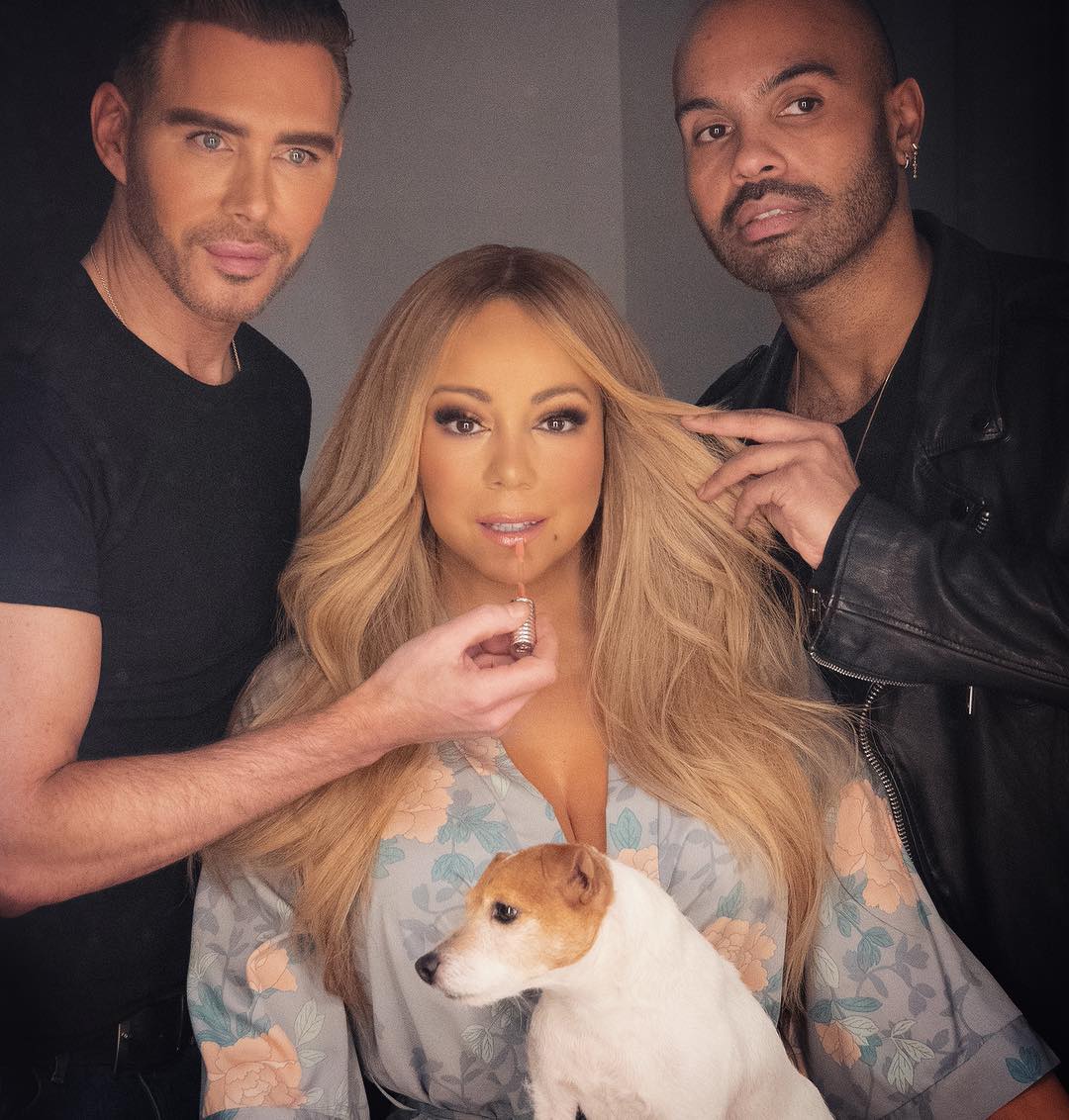 Mariah is surrounded by men