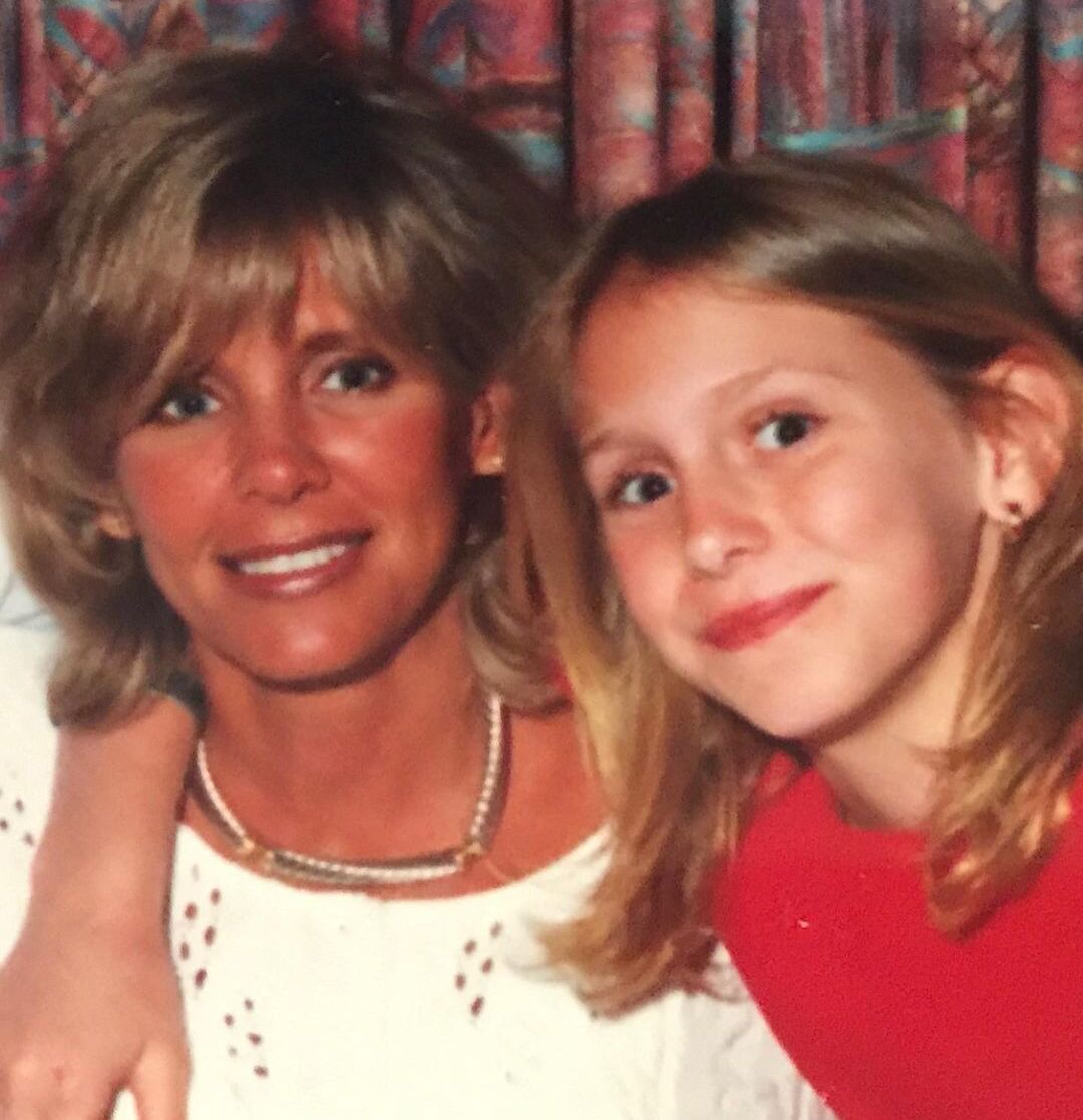 Young Charlotte Flair with her mom