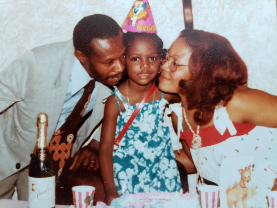 Young Karine Jean-Pierre with her parents