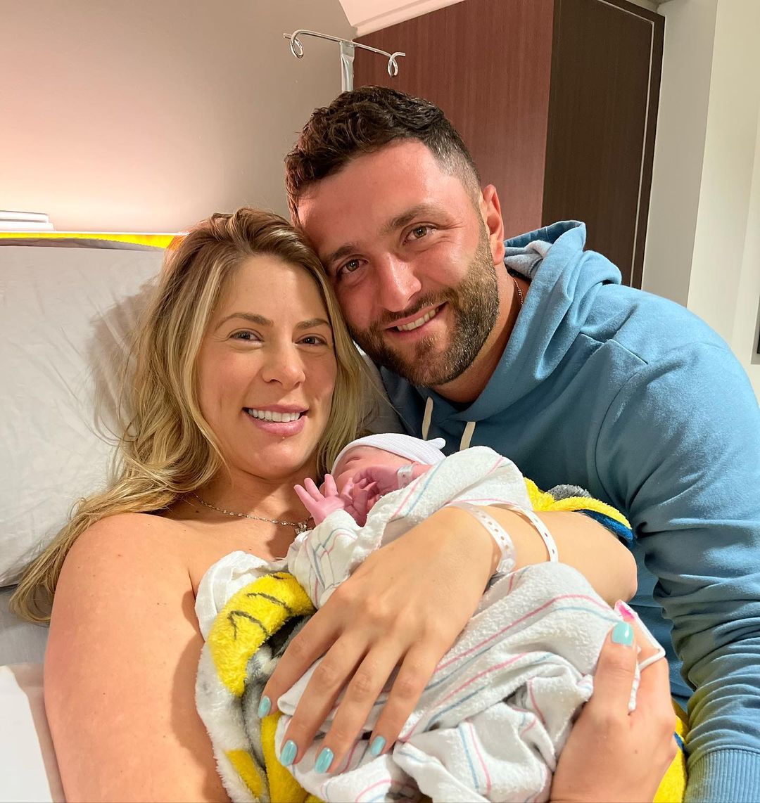 Jon Rahm with his wife and son