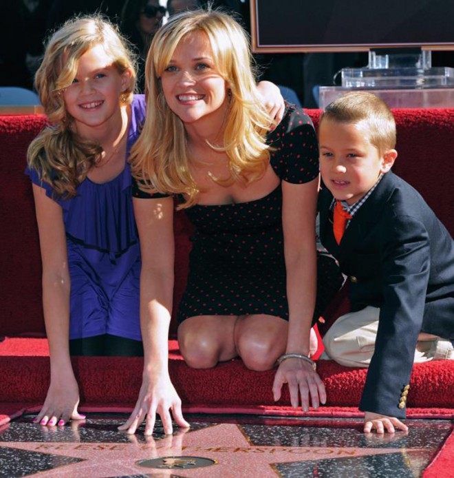 Reese Witherspoon with children near the star on the Walk of fame in Hollywood