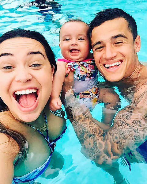 Philippe Coutinho with his wife and child