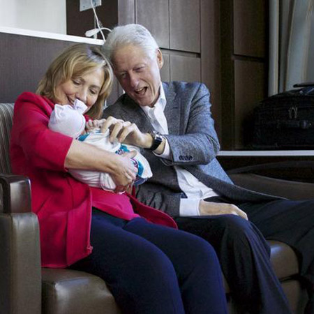 Hillary and Bill Clinton with granddaughter Charlotte
