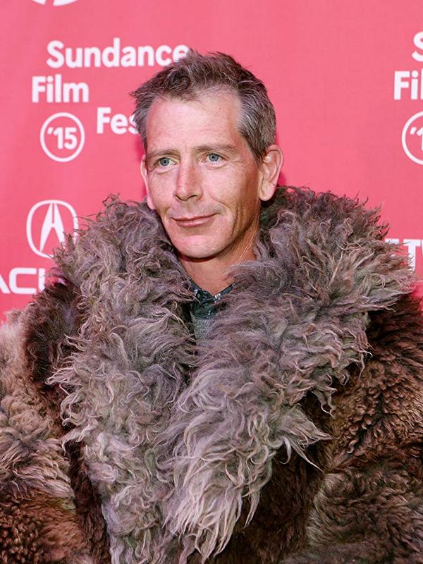 Ben Mendelsohn in a fur coat
