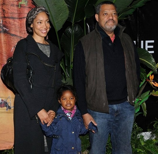 Gina Torres and Lawrence Fishburne with her daughter